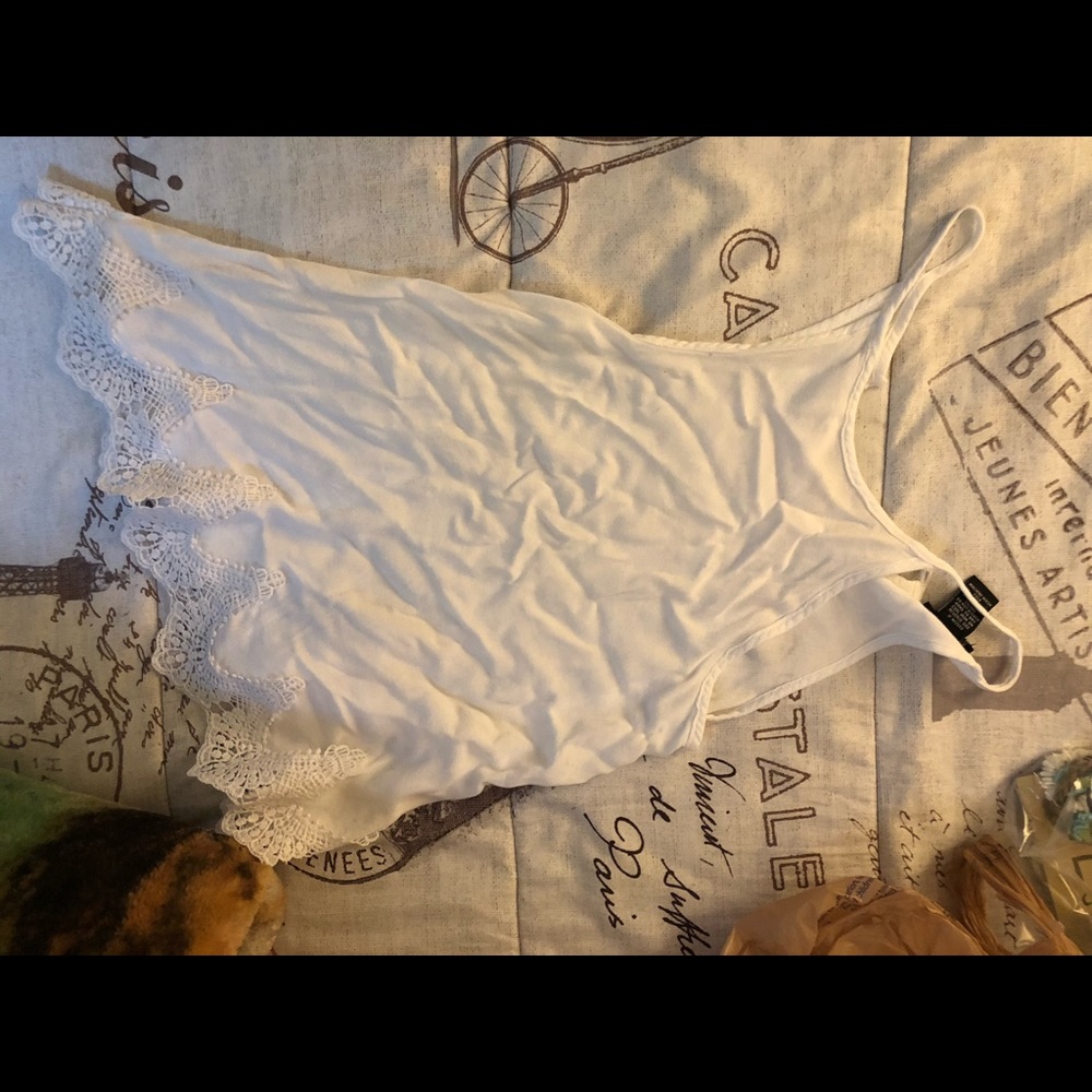 A white loose fitted top.